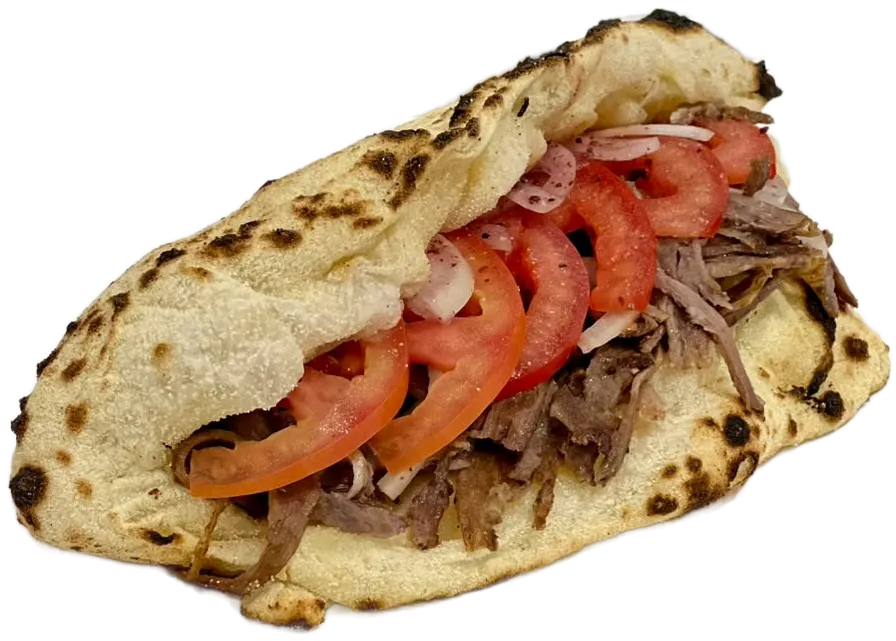 Klasik Döner: taş fırında pişmiş, kenarları leopar yanıklı Napoli ekmeğinin içinde et döner, domates dilimleri ve soğan.